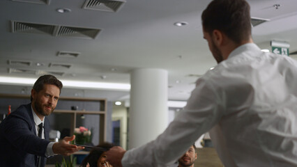 Coporate people shaking hands making deal in marketing company conference office