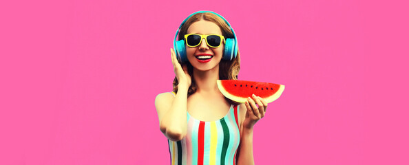 Summer colorful portrait of cheerful happy smiling young woman model posing in headphones listening...