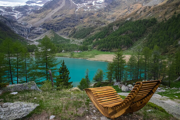 Magical panoramic landscape with a lake in the mountains in the Swiss Alps. Switzerland. Graubunden . Alp Grum lake