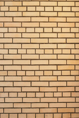 vertical modern yellow brick wall as a textured background