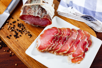 Delicious spicy cured pork sirloin produced by traditional methods, thinly sliced