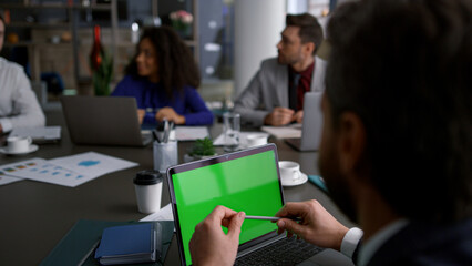 Multiracial business team meeting use laptop chroma key research data in office.