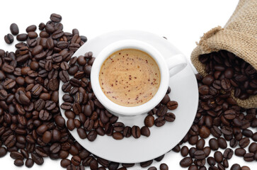 Coffee in a cup, coffee beans in a bag isolated on white.