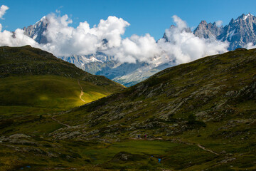 Fototapeta premium The view of Massif du Mont Blanc from the hiking trail between Refuge de Bellachat and Aiguillette des Houches, September, Les Houches, French Alps.
