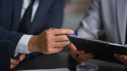 Businessman hands writing document analysing corporate report in company office.