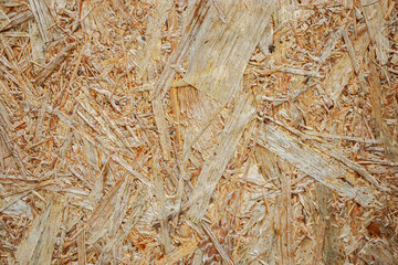 Pressed shavings. Wooden texture OSB Board. Building material for renovation.