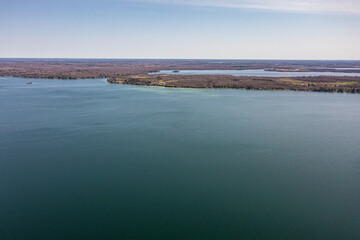 Cumberland beach  amigo beach  water drone view islands  in Ontario Canada  summer time blue skies 