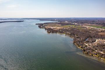 Cumberland beach  amigo beach  water drone view islands  in Ontario Canada  summer time blue skies 
