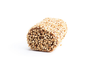 Sponge cake roll covered with nuts isolated on white background