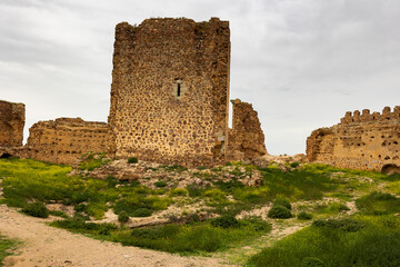 Dramatic view of ruined Almonacid de Toledo at Spanish province of Toledo castle at cloudy spring day © JackF