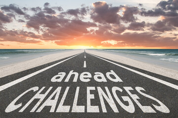 Challenges ahead text on road into the future.