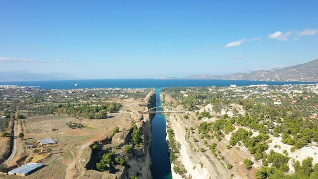 A bridge over the Corinth Canal facing the Ionian Sea in Europe, Greece, Peloponnese, Corinthia in summer on a sunny day.