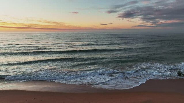 Sunrise seascape with clouds at Shelly Beach on the Central Coast, NSW, Australia.