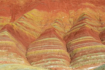 Photo sur Plexiglas Zhangye Danxia Close up, background picture of the red, green, yellow, orange layers of the Chinese rainbow mountains of Zhangye Danxia National Geological park, Gansu, China, geology