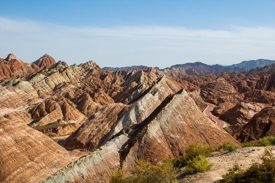 Sharp peaks of the Chinese rainbow mountains of Zhangye Danxia National Geological park, Gansu, China, blue sky, copy space for text