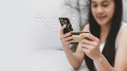 Asian woman holding mobilephone and credit card with various icon concept payment pay for food...