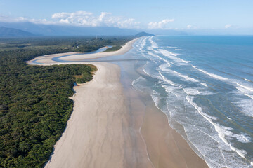 Fototapeta na wymiar Aerial image of the meeting between Rio and the Sea. Environmental reserve, beautiful and empty beach