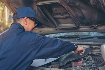 Mechanic car service auto garage in automotive mobile center. Technician workshop repair engine...