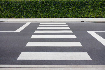 Pedestrian crossing on asphalt road.