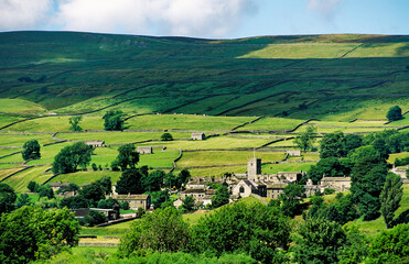 The village of Askrigg in typical Yorkshire Dales National Park landscape in Wensleydale in North...