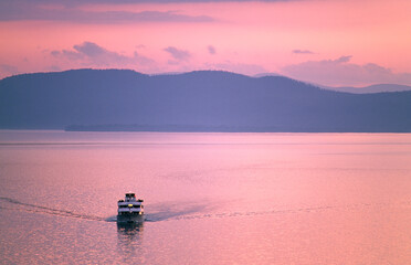 Lake Champlain, New England, USA. Cruise boat called Ethan Allen looking west from Vermont shore at...