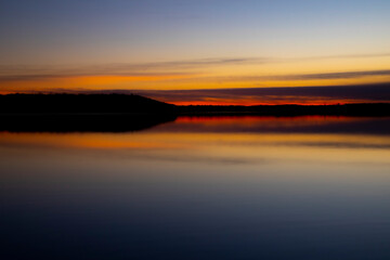 Fototapeta na wymiar A Sunset over Kansas lake