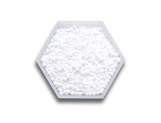 Carbamide in hexagonal molecular shaped container on white background.