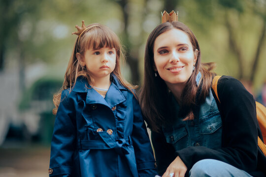 Mother and Daughter Wearing Crown Party Accessories Having Fun