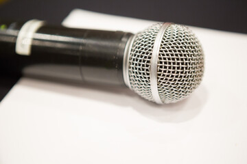 Selective focus of Microphone on stage floor background