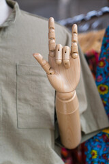 Wooden finger puppets signify love, Love hand sign