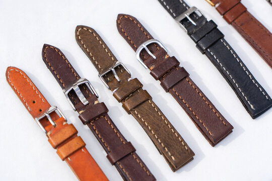 leather handmade watch strap with steel buckle on white background