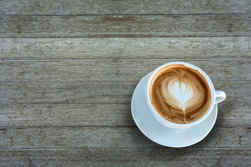 Coffee cup top view on wooden table background