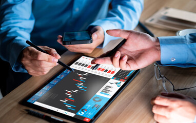 Businessman analyzing investment stock market and economic growth graph chart on tablet