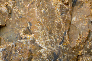 Brown background. Texture of stone, rocks. Geological material.