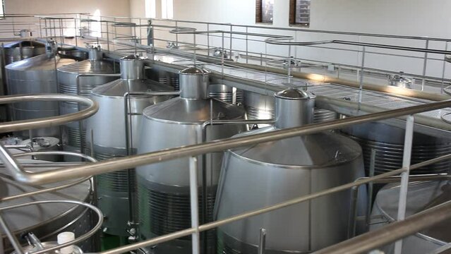 Metallic cisterns for processing and fermentating wine in fabric shop