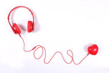 Red headphone with red heart isolated on white background, flat lay photography have copy space.