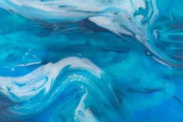  Epoxy resin art. Texture of blue and white paint. Fluid art, kintsugi. Close up