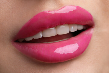 Fototapeta premium Young woman with perfect lips makeup, closeup