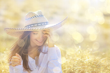 summer sunny portrait of a happy girl, female happiness sun glare straw field country style