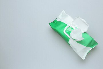 Wet wipes flow pack on light background, top view. Space for text