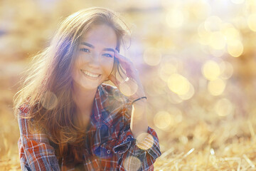 summer sunny portrait of a happy girl, female happiness sun glare straw field country style