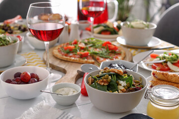 Many different dishes served on buffet table for brunch