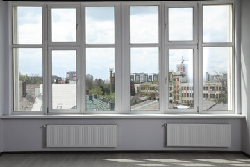Fototapeta na wymiar Modern office with window and radiators. Interior design
