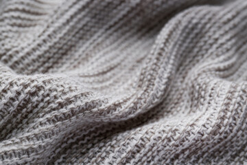 Beautiful grey knitted fabric as background, closeup
