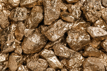 Many gold nuggets as background, top view