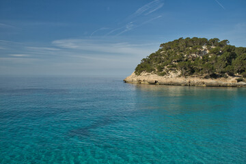 Obraz premium Panoramic view of an island in the middle of the sea, Inspiring scene of vacation trips in nature by the sea on a sunny day with blue sky. Copy space for text.