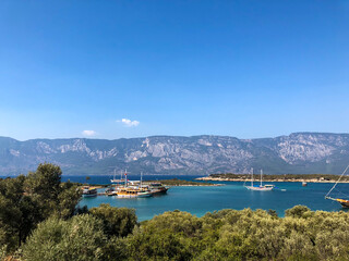 Fototapeta premium View from the mountain to the pier with yachts in the city of Marmaris