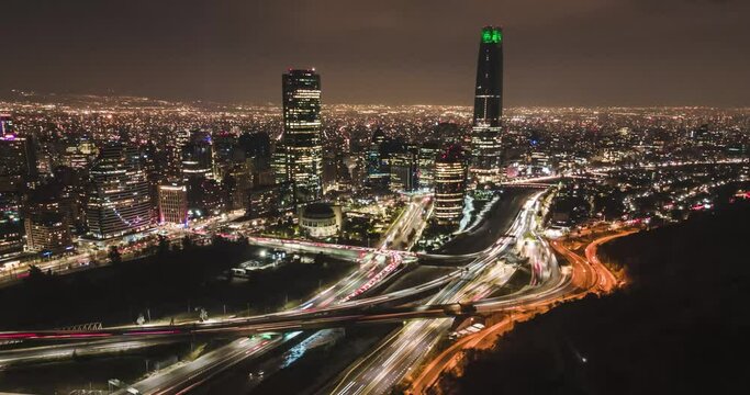 Aerial hyperlapse in orbit of santiago de chile at night with car trails passing by