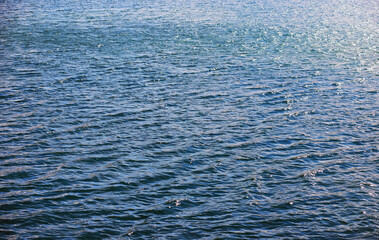 Water surface. The texture of the water. Waves on the lake in windy weather.