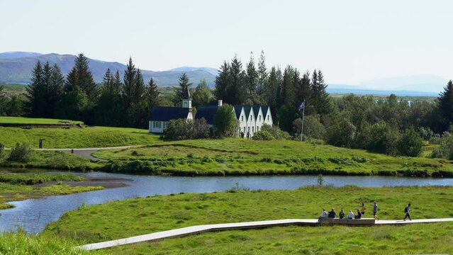 Cinematic aerial footage of Thingvellir national park, Iceland's parliament, the Thingvellir Church and the ruins of old stone shelters, hikes and lake in the golden circule